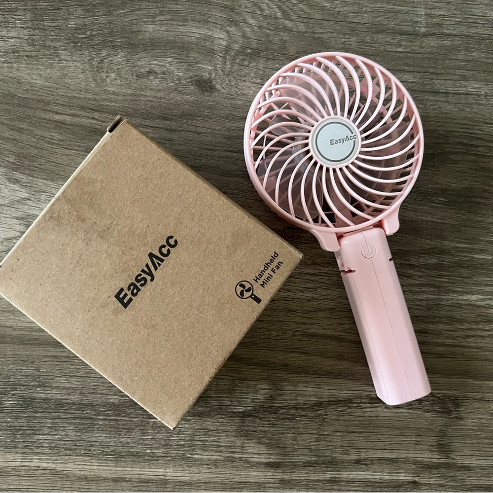Pink handheld fan with usb charger